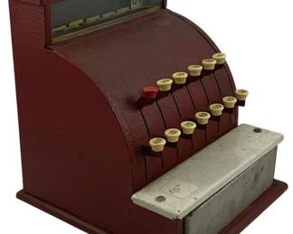 927 - Vintage Red Metal Toy Cash Register (Description): Vintage metal toy cash register in red with a silver tone drawer. Features two rows of push-button keys with cream colored numbered tops and a red 'No Sale' button. The display window at the top shows price tabs. This charming toy replicates the look of classic mid-century cash registers. Measures 8" x 16" x 5". Used as is electric/electronic/mechanical item. No guarantee all components, untested.