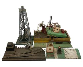 526 - Lot O Scale Train Decorations (Description): A lot of O scale train decorations suitable for model railroad layouts. The collection includes various accessory pieces for enhancing train display scenes.