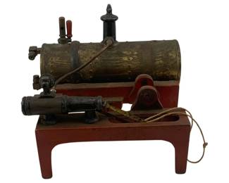 919 - Weeden Steam Engine Toy 6.5"x7"x5.5" (Description): Weeden steam engine toy featuring a brass horizontal boiler mounted on a red painted cast iron base with four legs. The engine includes a black painted cylinder, flywheel mechanism with drive belt, safety valve with finial top, and red wooden handle. A classic example of early 20th century educational steam toys. Measures 6.5" x 7" x 5.5".