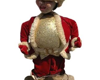 503 - Animatronic Christmas Elf 34"x15"x10" (Description): Animatronic Christmas elf figure dressed in a red velvet Santa-style suit with white fur trim and a glittery gold vest. Features a pointed elf hat and stands on a base. Measures 34 inches tall by 15 inches wide by 10 inches deep.