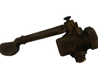 951 - Sherburne Co. Boston Mass Brass Whistle (Description): Brass railroad whistle manufactured by the Sherburne Company of Boston, Massachusetts. This vintage industrial piece features a lever-operated mechanism typical of railroad signaling equipment. Measures 2 inches by 8 inches by 4 inches.