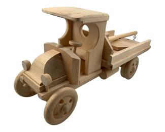 467 - Truckworks Wood Tow Truck 7.5"x16.5"x6" (Description): Truckworks wood tow truck. This handcrafted wooden toy truck features classic vintage styling with an open cab, flatbed, and tow mechanism. Measures 7 1/2" x 16 1/2" x 6".