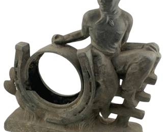 635 - Vintage Cast Iron Western Cowboy Sculpture (Description): Vintage cast iron western sculpture featuring a cowboy figure seated on a fence with a horseshoe. Measures 11 1/2 inches by 11 inches by 3 inches.
