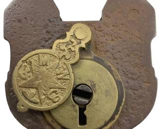 676 - M&W Co Padlock w/o Key 3.5"x2.5" (Description): M&W Co padlock without key. The padlock features a brass keyhole cover with decorative embossing. Measures 3 1/2" x 2.5".