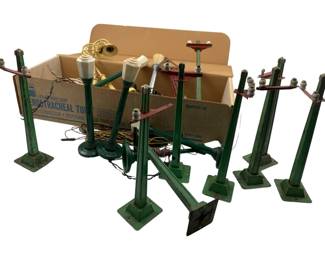 239 - Vintage Train Track Lights (Description): Vintage train track lights featuring green painted metal poles and bases with various configurations including single posts and multi-arm designs. Collection includes multiple pieces with attached wiring.