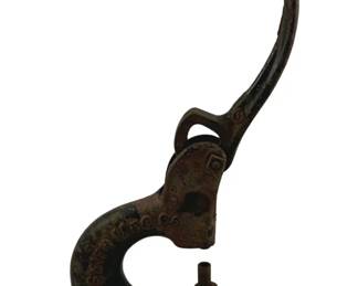 896 - Victor Riveting Tool 8.5"x6"x3" (Description): Victor riveting tool by E.H. Smith Mfg Co., Chicago, USA. This antique cast iron hand press features a lever-action mechanism with a curved handle for leverage. The body displays raised lettering with the manufacturer's name and location. The piece shows an aged patina with some surface rust consistent with its age. Measures 8.5" x 6" x 3".
