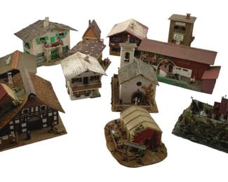 384 - Group Lot of Model Train Display Houses (Description): Group lot of model train display houses. This collection includes various miniature buildings suitable for model train layouts or village displays.