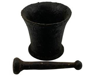971 - Cast Iron Mortar & Pestle 2pc. Set 5.25"x5.5" (Description): Cast iron mortar and pestle two-piece set. This sturdy utilitarian set features a flared mortar with a footed base and a double-ended pestle. Measures 5.25" x 5.5".