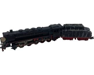 309 - Marklin Locomotive w/ Coal Car 2"x2"x10" (Description): Marklin locomotive with coal car, featuring classic black body with red trim and detailing on the wheels and undercarriage. The steam locomotive displays traditional German engineering design with a matching tender car. Measures 2 inches by 2 inches by 10 inches overall.