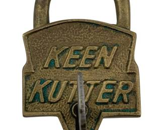 620 - E.C. Simmons Keen Kutter Padlock w/ Key (Description): E.C. Simmons Keen Kutter padlock with key. This vintage brass padlock features the iconic Keen Kutter logo and branding, with E.C. Simmons marked on the shackle. Measures 3 1/2" x 2".