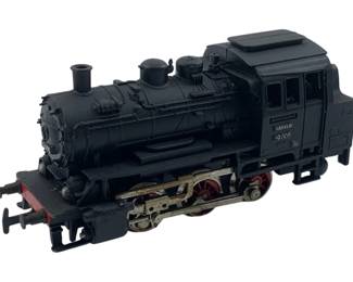 294 - Marklin HO Scale Steam Locomotive 89005 (Description): Marklin model steam locomotive, number 89005. This HO scale tank engine features a black body with red wheel accents and detailed running gear. The locomotive displays classic German styling typical of Marklin's vintage train offerings. Measures 2" x 2" x 4".