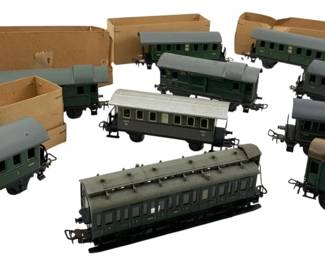 268 - Marklin Germany Train Cars Lot 2"x2"x6" (Description): These vintage model railroad passenger and freight cars feature various styles and colors. Some cars retain their original boxes. Each car measures approximately 2" x 2" x 6".