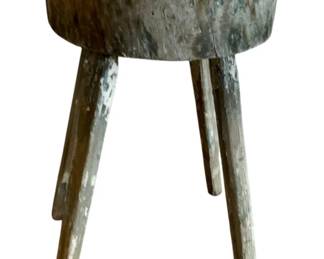 153 - Rustic Wood Stump Table 18"x10" (Description): Rustic wood stump table featuring a thick round top supported by four splayed legs. The piece displays a beautifully weathered patina with traces of old paint, giving it authentic primitive character. Measures 18 inches tall by 10 inches in diameter.