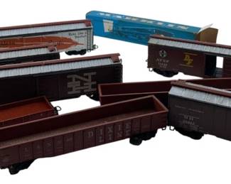 250 - Group Lot of Marklin Train Cars 2"x2"x8" (Description): The collection includes various freight cars and boxcars in assorted styles. Each car measures approximately 2 inches by 2 inches by 8 inches.