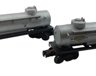 338 - Lionel Sunoco Fuel Tanker Train Carts Group (Description): Group of 2 Lionel Sunoco fuel tanker train carts. Each cart measures 3 inches by 8 inches by 2 inches.