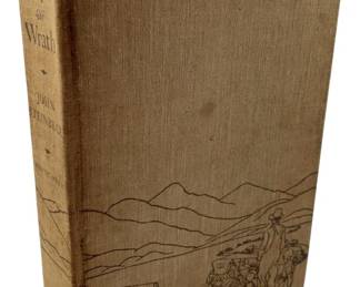 137 - 1939 The Grapes of Wrath by John Steinbeck (Description): A 1939 edition of "The Grapes of Wrath" by John Steinbeck, published by The Viking Press. This hardcover volume features the original beige cloth binding with the iconic pictorial illustration depicting the Dust Bowl migration scene on the front cover. The binding shows the characteristic design associated with early printings of this Pulitzer Prize-winning novel.