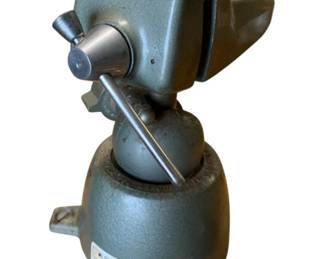724 - Pana Vise USA Adjustable Vise (Description): Pana Vise made in USA. This adjustable vise features a ball joint base allowing for multi-directional positioning. Measures 7" x 5" x 4.5". Needs to be removed from mounting surface.