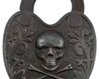 661 - Skull & Bones Padlock w/o Key 3.5"x2.5" (Description): Skull and crossbones padlock without key. The padlock features a decorative skull and crossbones motif. Measures 3 1/2" x 2.5".