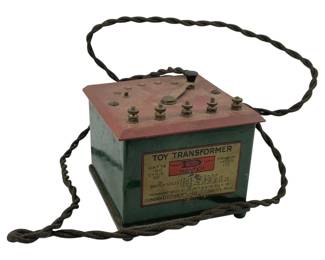 781 - Dongan Electric Toy Transformer 3.5"x5"x5" (Description): Dongan Electric toy transformer measuring 3 1/2" x 5" x 5". This vintage electrical device features a metal housing with control knobs and binding posts on the top panel, along with an attached twisted cloth power cord. Used as is electric/electronic/mechanical item. No guarantee all components, untested.