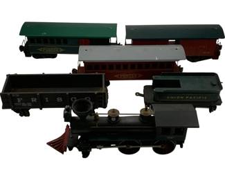 1150 - 6pc. Lot O Scale Trains 3"x5.5"x2" (Description): Six-piece lot of O scale model trains measuring 3" x 5.5" x 2". The collection includes a black steam locomotive numbered 2561 with red cowcatcher, a Union Pacific tender car, a Frisco coal hopper, and three passenger cars including two Pioneer cars with green roofs and a maroon passenger car with gray roof. The trains feature vintage styling representative of classic American railroading.