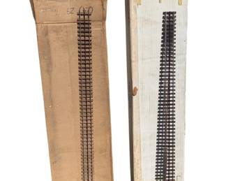465 - 2 Boxes of Train Tracks (Description): Two boxes of train tracks. The tracks appear to be model railroad straight track sections suitable for layout building.