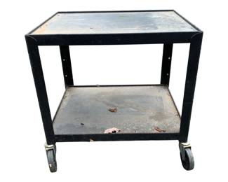 407 - Metal 2 Tier Cart 24"x24"x18" (Description): Metal two-tier cart on casters. Features an upper and lower shelf for storage and transport. Measures 24 inches by 24 inches by 18 inches.