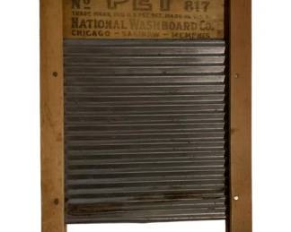 174 - Little Pet Lingerie Washboard 12"x7" (Description): Little Pet No. 817 washboard by National Washboard Co., featuring locations Chicago, Saginaw, and Memphis on the label. This vintage laundry accessory has a corrugated metal washing surface set in a wooden frame. The washboard bears the trade mark registration and Made in U.S.A. markings. Measures 12" x 7".