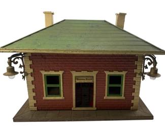 226 - Vtg Prewar Lionel 124 Tinplate Waiting Room (Description): Vintage prewar Lionel 124 tinplate waiting room station. This classic train accessory features detailed construction typical of early Lionel production. Measures 11 inches by 14 inches by 9 inches.