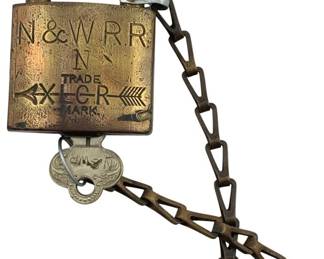 602 - N & WRR N Trade Padlock w/Key 3"x2" (Description): Norfolk and Western Railroad trade padlock with original key. The brass lock features the N & WRR markings and includes an attached chain. Measures 3 inches by 2 inches.