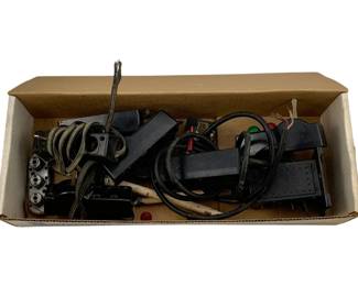 947 - Box Lot Train Parts (Description): A box lot of assorted train parts. The collection includes various components suitable for model railroad enthusiasts or collectors seeking replacement parts.