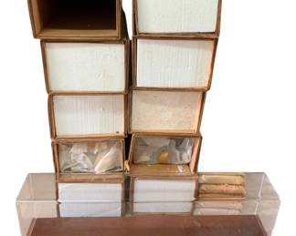 434 - Group Lot of 10 Display Cases for Trains (Description): Group lot of 10 display cases designed for trains. The cases feature clear acrylic covers with wood-tone bases, ideal for showcasing model train collections. Measuring 7 inches by 25.5 inches by 5.5 inches.