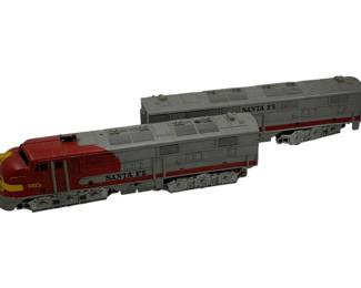 997 - Lionel Santa Fe Locomotive & Cargo Car 3.5" (Description): Lionel Santa Fe locomotive and cargo car set. The locomotive is numbered 1095 and features the classic Santa Fe livery. Measures 3.5 inches.