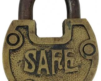 667 - Safe Padlock w/o Key 2.25"x1.75" (Description): Vintage brass padlock embossed with the word "Safe" on the front. This padlock does not include a key. Measures 2 1/4" x 1.75".