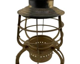 700 - Southern Railway Railroad Lantern 11"x7" (Description): Featuring a metal frame construction with a wire globe guard and ventilated top. The lantern displays an aged patina consistent with its vintage railroad origins. No globe. Measures 11 inches by 7 inches.