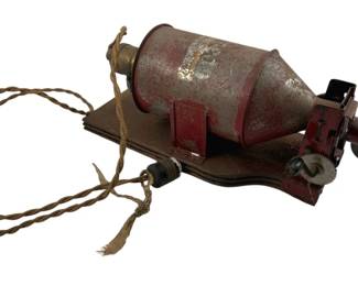 784 - Antique Dispenser 6"x15"x6" (Description): Antique dispenser mounted on a shaped base with mechanical gearing mechanism and braided cord. The cylindrical dispenser body shows patinated red painted finish. Measures 6 inches by 15 inches by 6 inches. Used as is electric/electronic/mechanical item. No guarantee all components, untested.