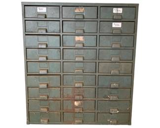 397 - 27 Drawer Metal Filing Cabinet (Description): A 27 drawer metal filing cabinet. Measures 37 inches high by 30.5 inches wide by 17 inches deep.