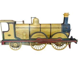 953 - Metal Locomotive Wall Art 17.5"x3.5"x1" (Description): Metal locomotive wall art piece featuring a decorative train engine design. Measures 17.5 inches by 3.5 inches by 1 inch.