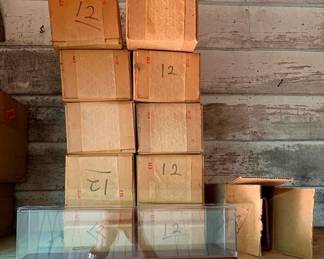 455 - Group Lot of 11 Train Display Cases (Description): Group lot of 11 train display cases. Each case measures 4.5 inches by 13 inches by 8.5 inches. Cases feature glass panels with wood-tone bases, ideal for showcasing model trains and railroad collectibles.
