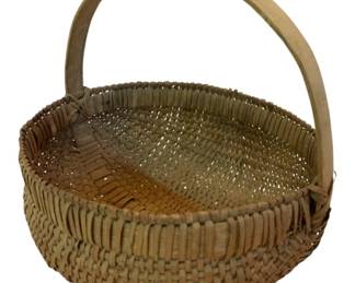 77 - Primitive Basket w/Handle 13"x11"x10" (Description): Primitive woven splint basket featuring a bent wood swing handle. The basket displays traditional handcrafted construction with a rounded body and slightly squared rim. Natural wood patina throughout indicates age and use. Measures 13" x 11" x 10"