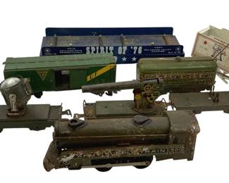 504 - Lot O Scale Trains (Description): A lot of O scale trains. The collection includes various cars and locomotives suitable for O gauge model railroad enthusiasts.