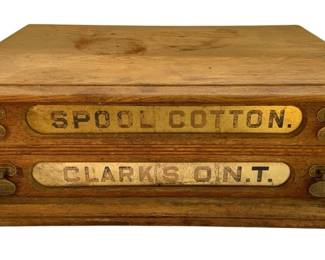 804 - Clark's O.N.T. Wooden Spool Cabinet (Description): Clark's O.N.T. wooden spool cabinet featuring two drawers with brass label plates reading "Spool Cotton" and "Clark's O.N.T." The cabinet measures 7 1/2" x 22" x 16".