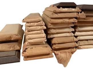 446 - Group Lot of Train Display Bases (Description): Group lot of assorted size train display bases. This collection includes multiple display bases in varying sizes, suitable for showcasing model trains. The bases appear to be wrapped for protection and storage.