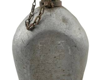 685 - U.S. F.L. & C 1918 Canteen 7.5"x5"x3" (Description): U.S. military canteen marked F.L. & C, dated 1918. This World War I era aluminum canteen features a screw-top cap with attached chain. Measures 7 1/2" x 5" x 3".