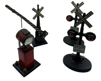 352 - Railroad Crossing Signs & Spotlight Model (Description): Group lot of railroad crossing signs and spotlight model train display pieces. The collection includes decorative crossing signals and a spotlight accessory suitable for model train layouts. Measures 8 inches.