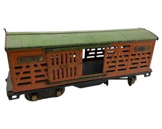 706 - Lionel Lines No 513 Cattle Train Car (Description): Lionel Lines No 513 Cattle Train Car. This vintage toy train car features the classic cattle car design with slatted sides for livestock transport. Measures 5 inches wide by 11 inches long by 4 inches high.
