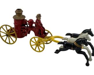 939 - Metal Horse w/ Fire Buggy #5 Damaged (Description): Metal horse-drawn fire buggy marked #5. This vintage cast metal toy features a fire pumper wagon with horses. The piece shows damage. Measures 4 inches high by 10 inches long by 3 inches deep.