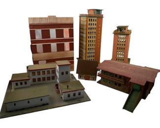 228 - Group Lot Train Display Buildings (Description): Group lot of train display buildings. This collection includes various architectural structures suitable for model train layouts and displays.