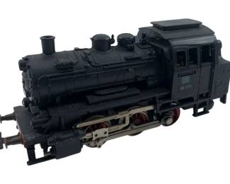 307 - Marklin Locomotive 2"x2"x4" (Description): Marklin locomotive model. This detailed miniature steam engine features the classic design associated with Marklin model trains. Measures 2 inches by 2 inches by 4 inches.