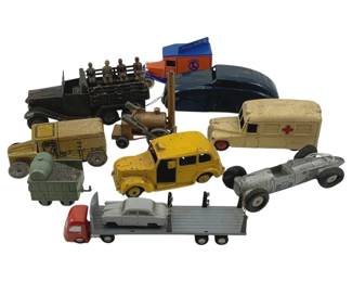 871 - 12pc Lot Die-Cast Cars Matchbox & Misc (Description): Collection of 12 die-cast toy vehicles including Matchbox and miscellaneous brands. The assortment features a variety of vintage vehicles including military trucks with soldiers, an ambulance, a yellow taxi cab, a Lionel delivery truck, a cement mixer trailer, a flatbed semi-truck, a silver racing car, and various other cars and trucks in different colors and styles. Measures 2" x 5" x 1.5".