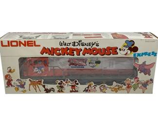 1035 - Lionel Mickey Mouse Locomotive O Scale (Description): Lionel Mickey Mouse locomotive in O scale, presented in its original box. This collectible train piece features Walt Disney's Mickey Mouse Express branding.